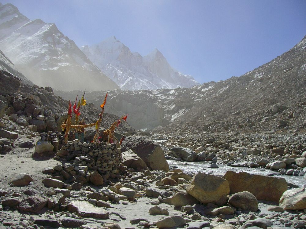 Prayer flags among boulders at Gaumukh, the snout of the Gangotri Glacier in the Indian Himalaya